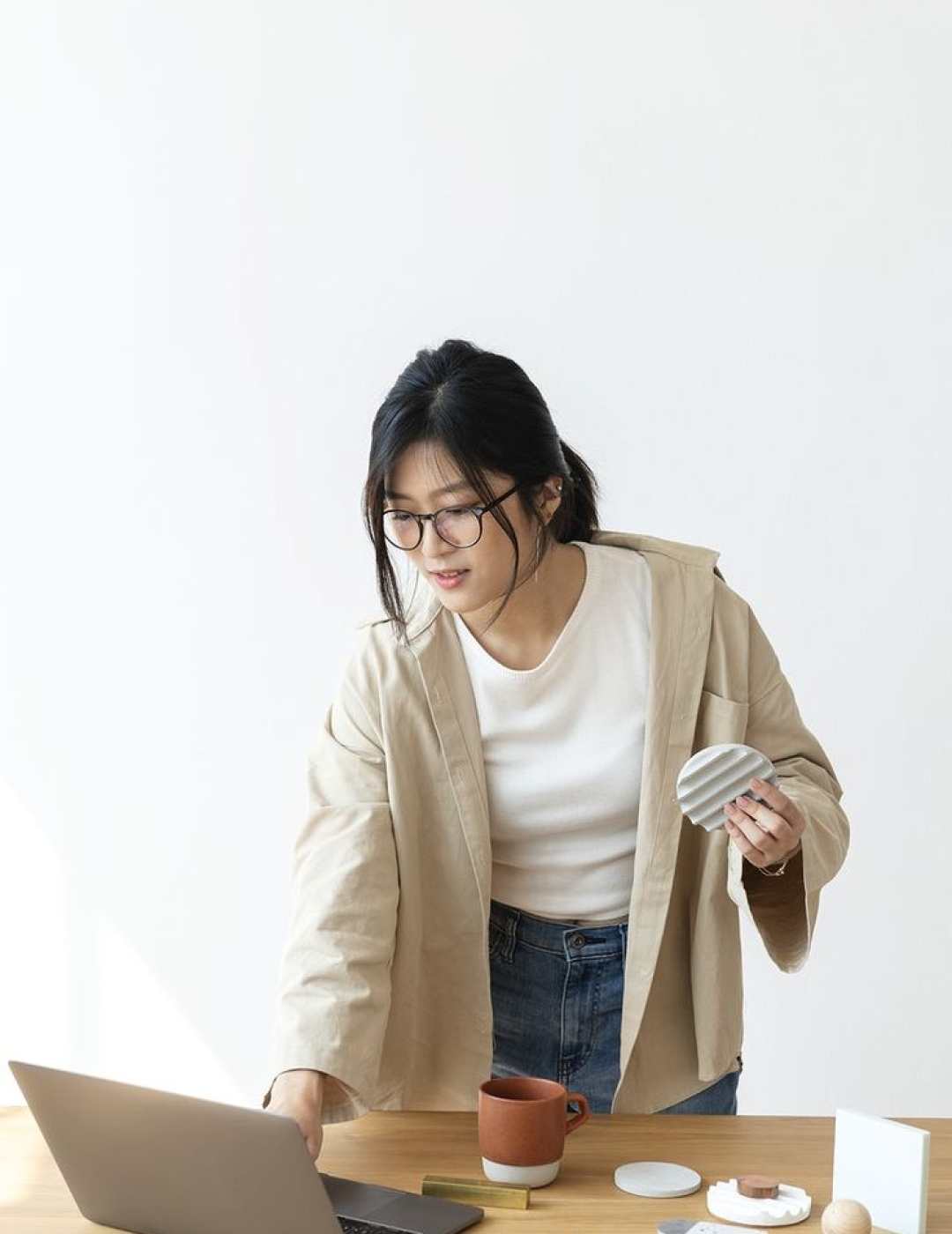 Download premium image of Asian girl working at home using a laptop by Jira about woman laptop, women working from home, chinese woman, white background, and laptop 2366319